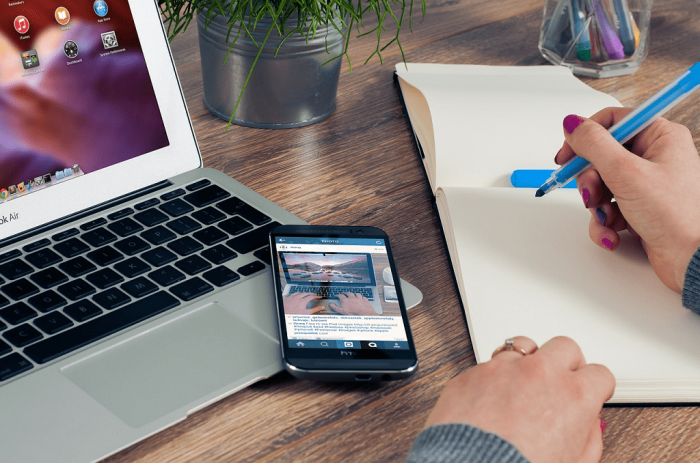 working with laptop and phone